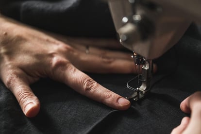 Apparel production black fabric in sewing machine